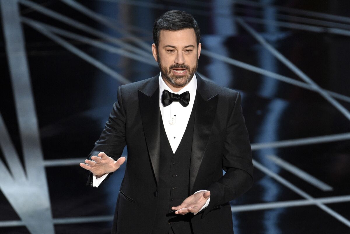Jimmy Kimmel onstage in a tuxedo.