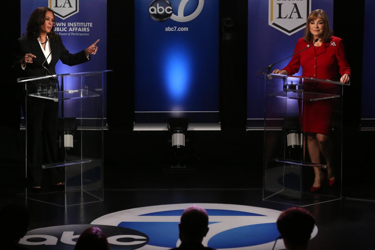 U.S. Senate candidates Kamala Harris, left, points a finger toward Loretta Sanchez during their debate at Cal State L.A. on Wednesday, Oct. 5.