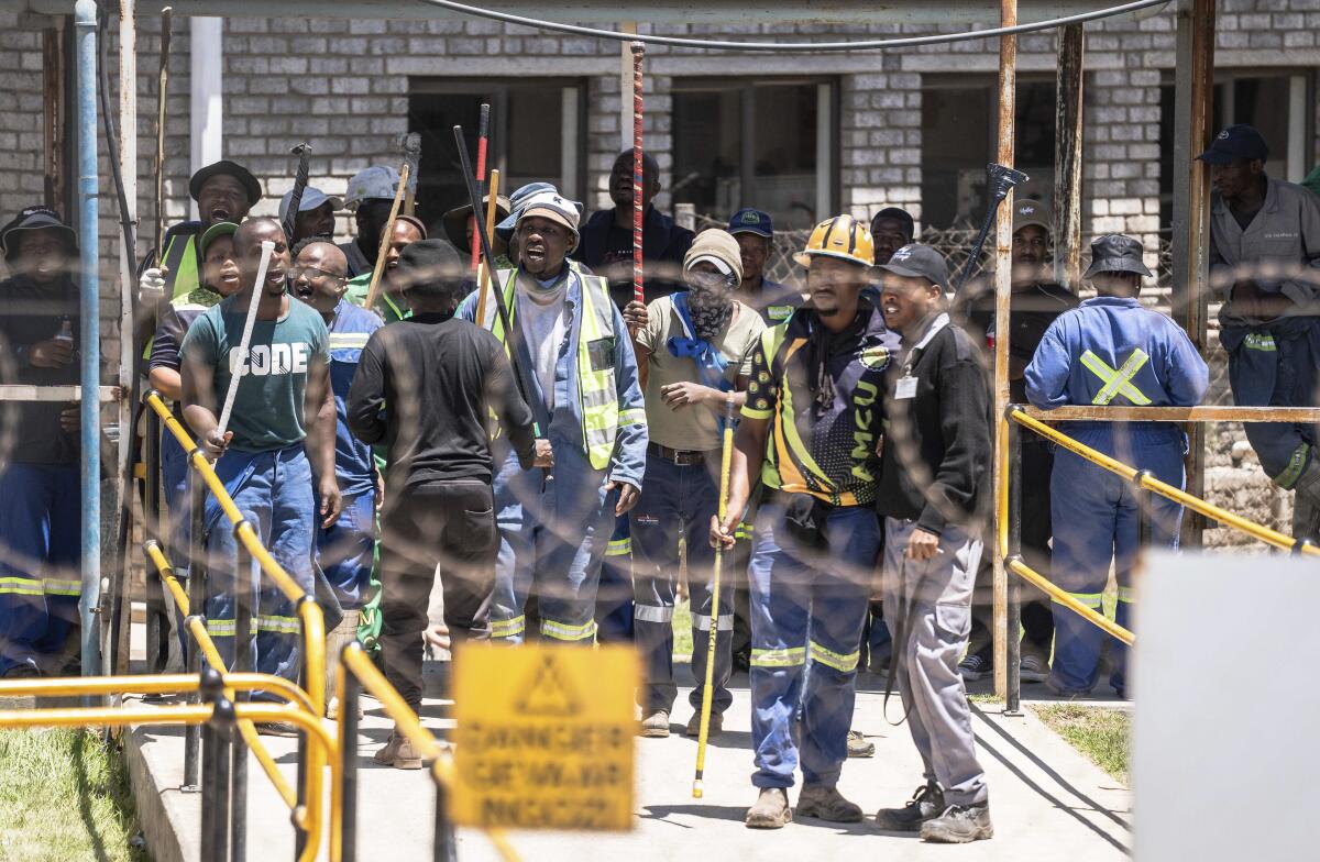 Mine workers at the entrance of a goldmine in Springs, near Johannesburg, South Africa.