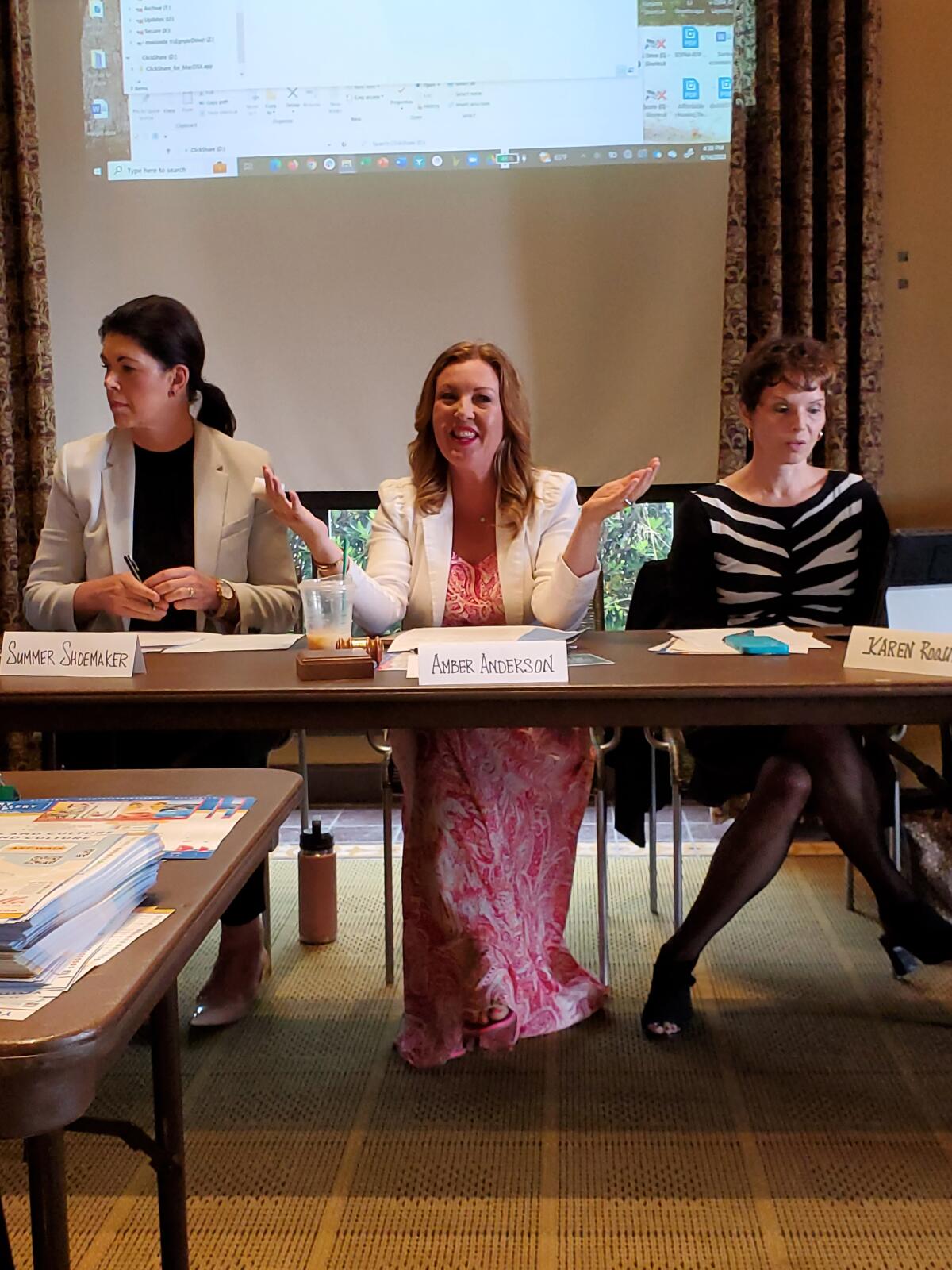 La Jolla Village Merchants Association board President Amber Anderson (center) leads a discussion.