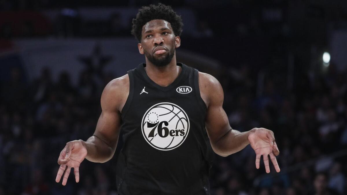 Philadelphia's Joel Embiid signals after hitting a three-pointer during the 2018 NBA All-Star game at Staples Center.