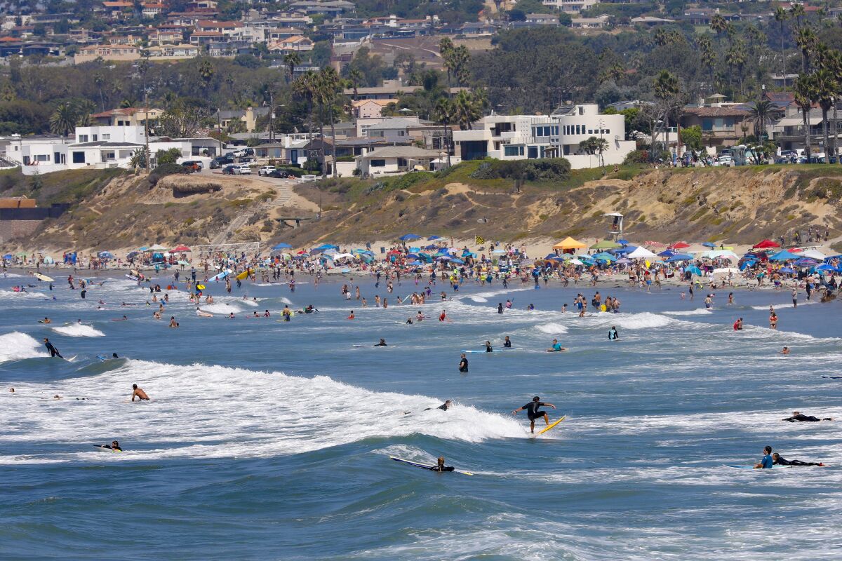 Large crowds on Saturday enjoyed the afternoon on the sand and in the water at Pacific Beach.