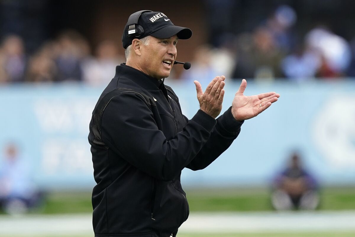 FILE - Wake Forest head coach Dave Clawson reacts during the first half of an NCAA college football game against North Carolina in Chapel Hill, N.C., Saturday, Nov. 6, 2021. For the first time since the College Football Playoff was introduced in 2014, the ACC will not be part of the four-team elimination format. (AP Photo/Gerry Broome, File)