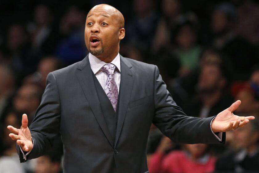 Then-Denver Nuggets coach Brian Shaw gestures during a game against the Brooklyn Nets in New York on Dec. 23, 2014.