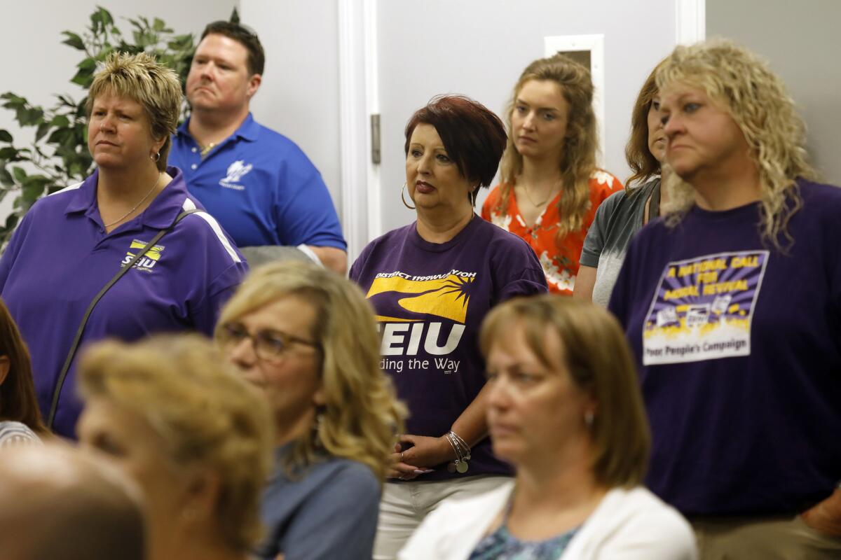Teachers from the local union listen to former paratrooper and state Sen. Richard Ojeda during the Democrat's campaign event in Huntington, W.Va., on July 6.