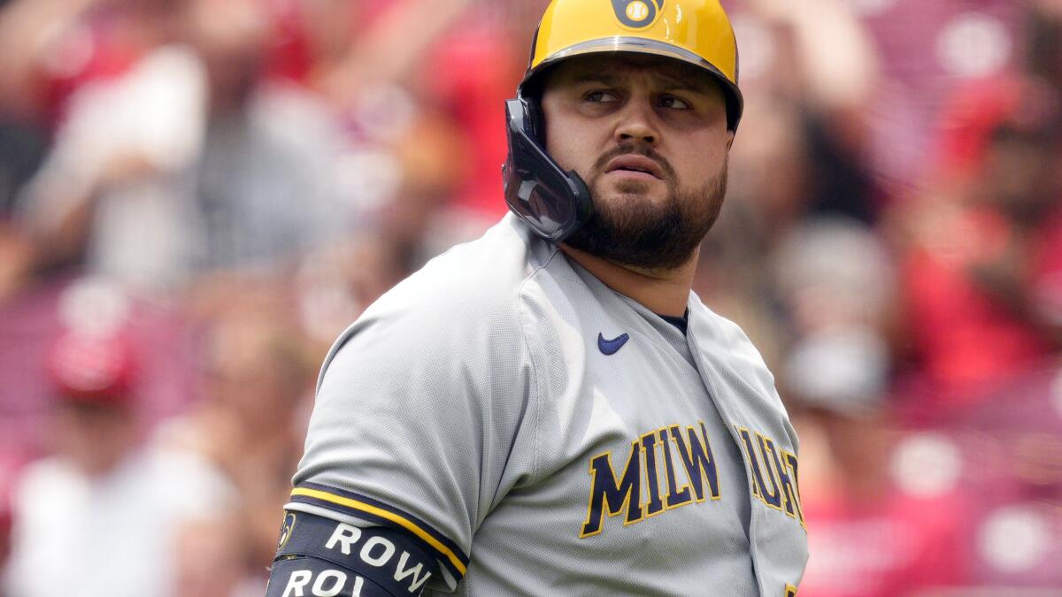 Milwaukee Brewers' Rowdy Tellez sits in the dugout during a