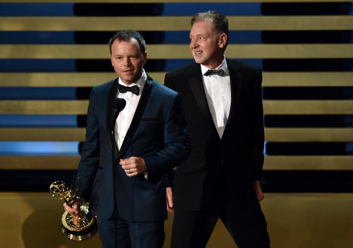 "Fargo" creator and executive producer Noah Hawley, left, and executive producer Warren Littlefield accept the Emmy for miniseries on Aug. 25, 2014.