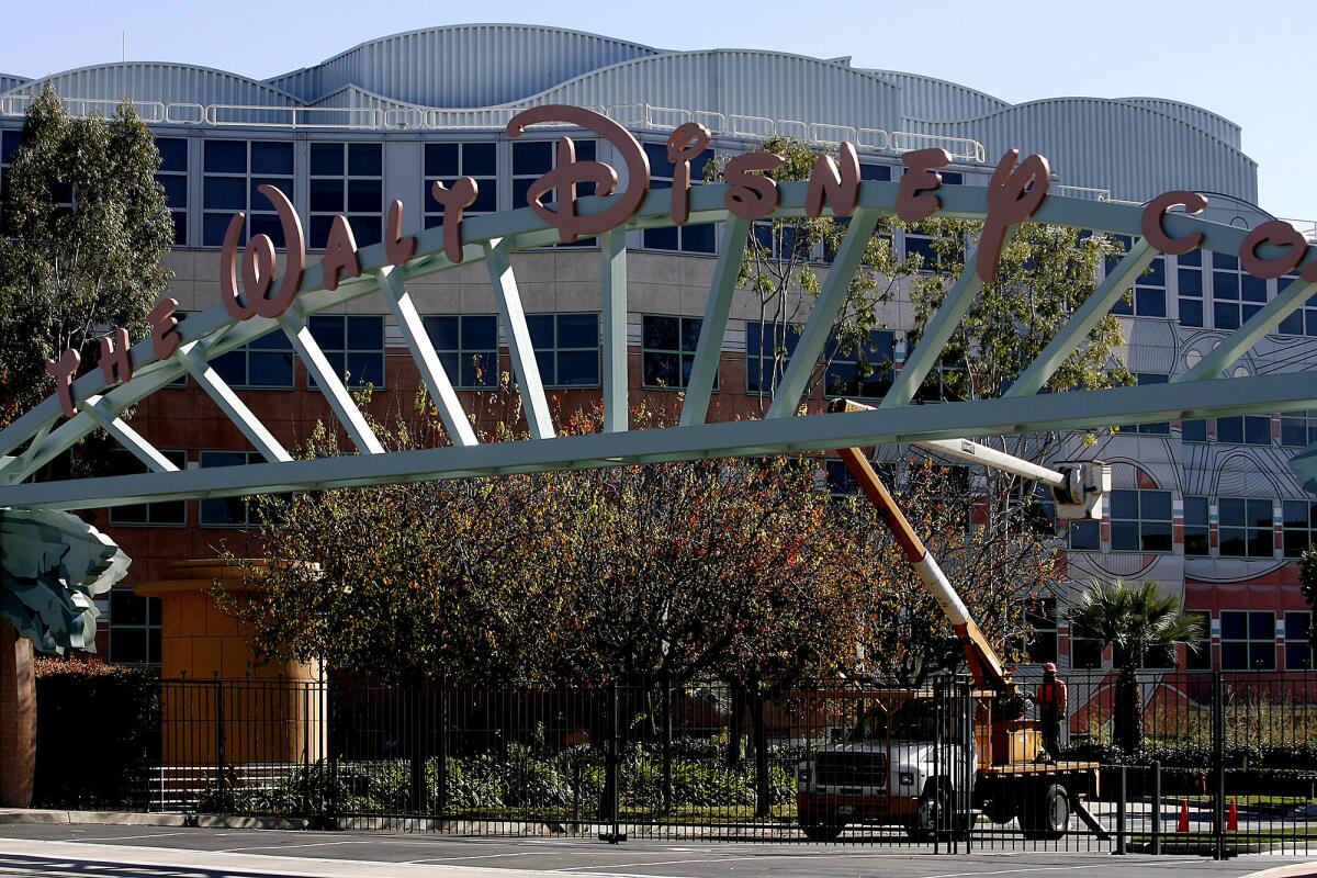 An entrance gate reading "The Walt Disney Co."