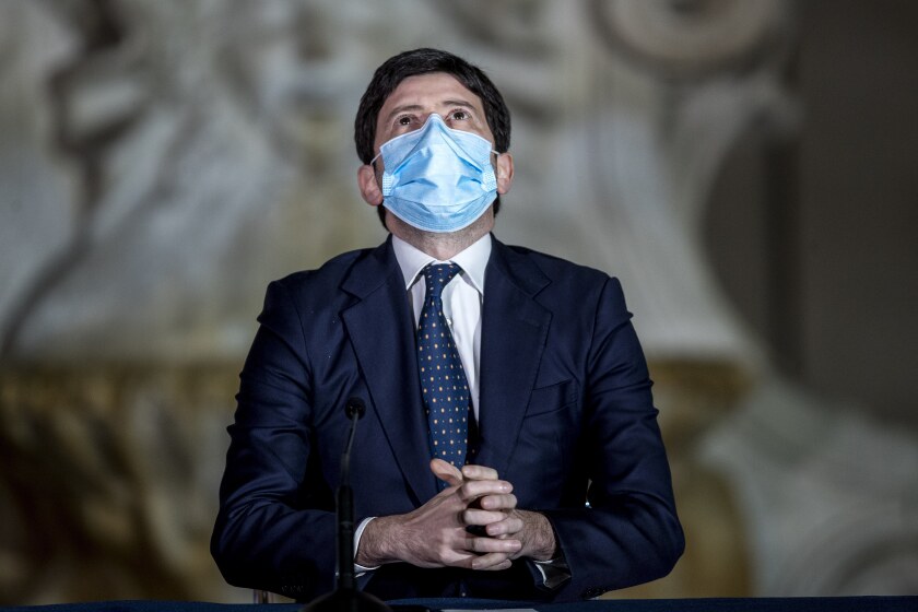 Italian Health Minister Roberto Speranza meets the media to illustrate the government's new measures to curb the spread of COVID-19 in Rome, Tuesday, March 2, 2021. The first anti-pandemic decree from Italy’s new premier, Mario Draghi, tightens measures governing school attendance while easing restrictions on museums, theaters and cinemas. (Roberto Monaldo/LaPresse via AP)
