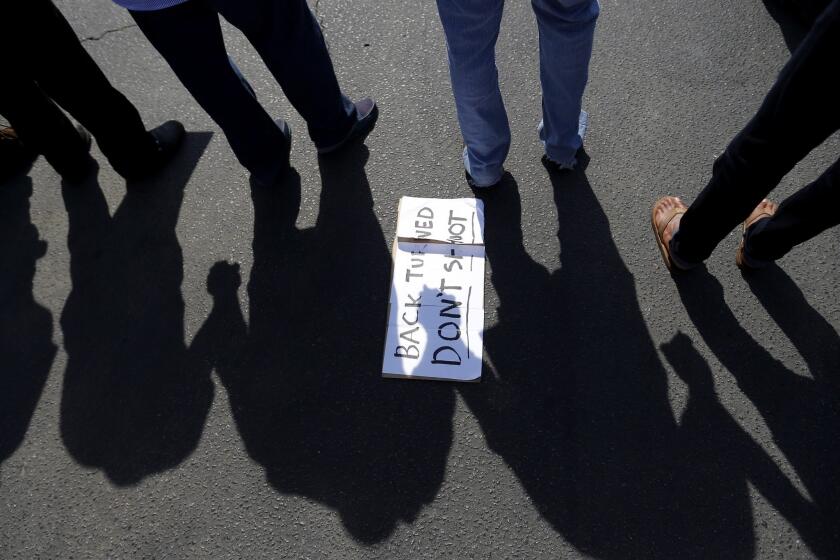 Protesters hold hands in a prayer circle April 8 after the shooting of Walter Scott.