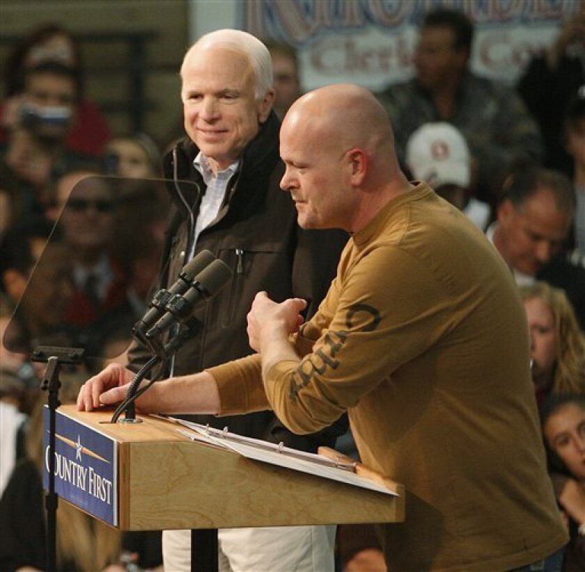 "Joe The Plumber" points to Republican presidential candidate Sen. John McCain, R-Ariz., endorsing his bid for the presidency during a campaign rally on McCain's Ohio campaign bus tour in Mentor, Ohio., Thursday night, Oct. 30, 2008. (AP Photo/Stephan Savoia)