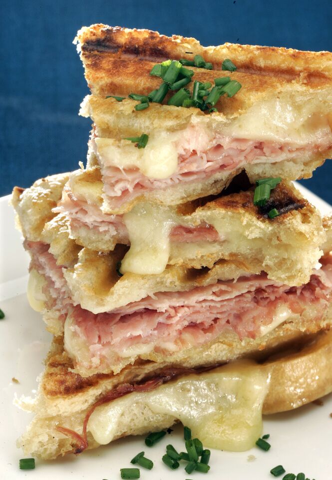 A croque-monsieur prepared on a panini grill combines Gruyère cheese and Black Forest ham into a sublimely golden melt.
