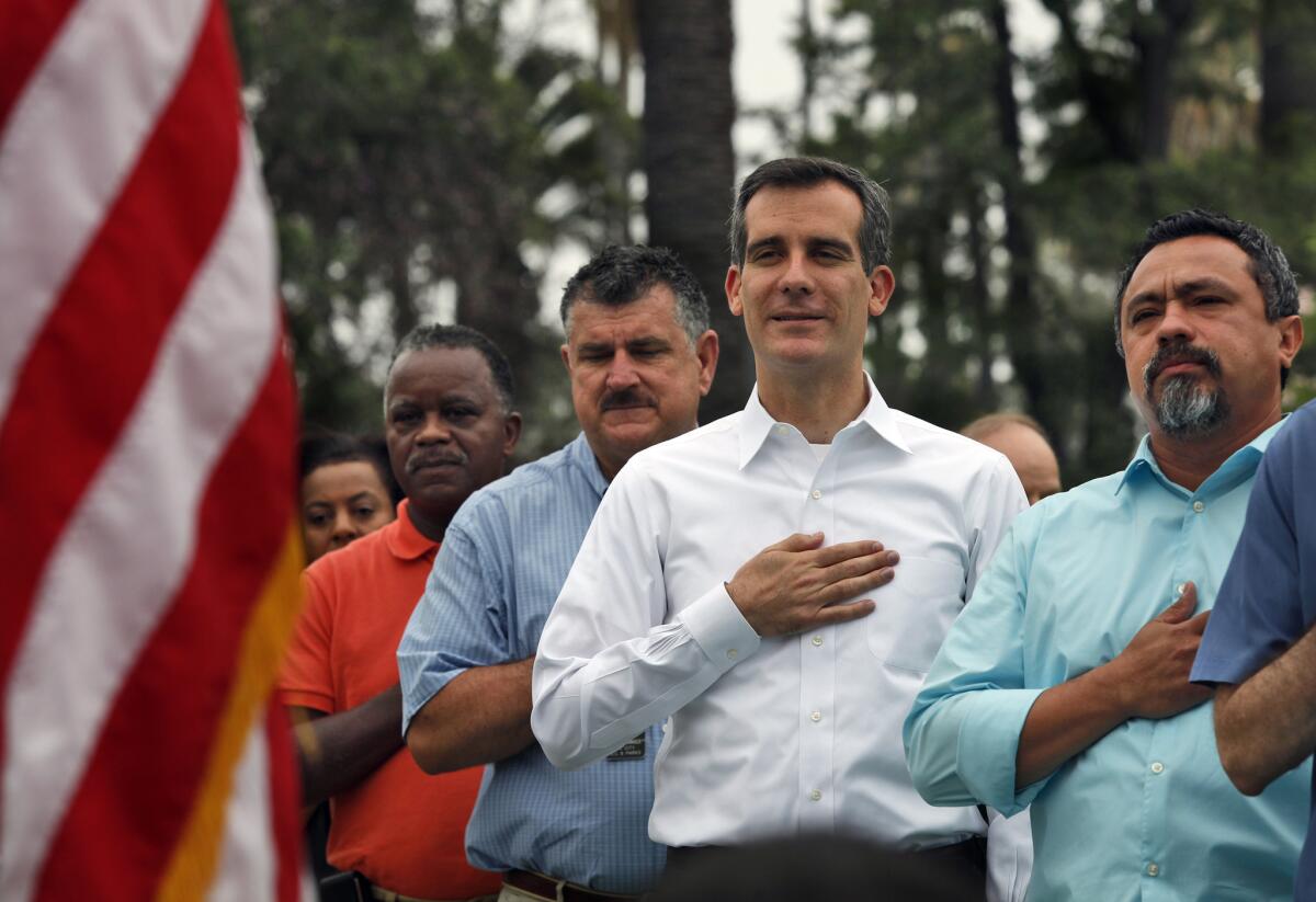 Mayor-elect Eric Garcetti and other officials at the opening ceremony of the newly refurbished Echo Park Lake.