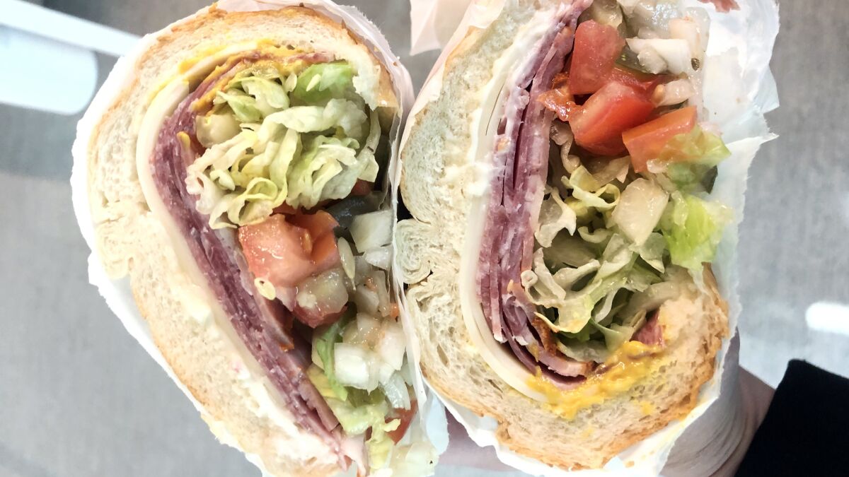 The Italian subs at Giamela's come with chopped tomato, onion and pickle. 