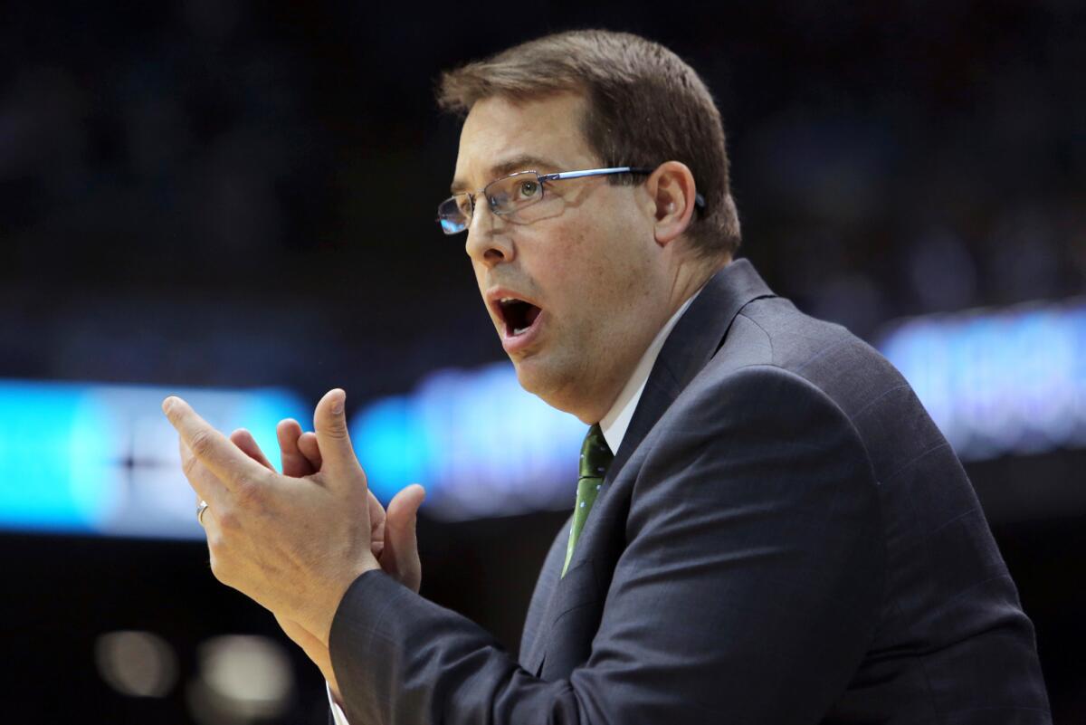 Jerod Haase encourages his players during a University of Alabama-Birmingham matchup against North Carolina.