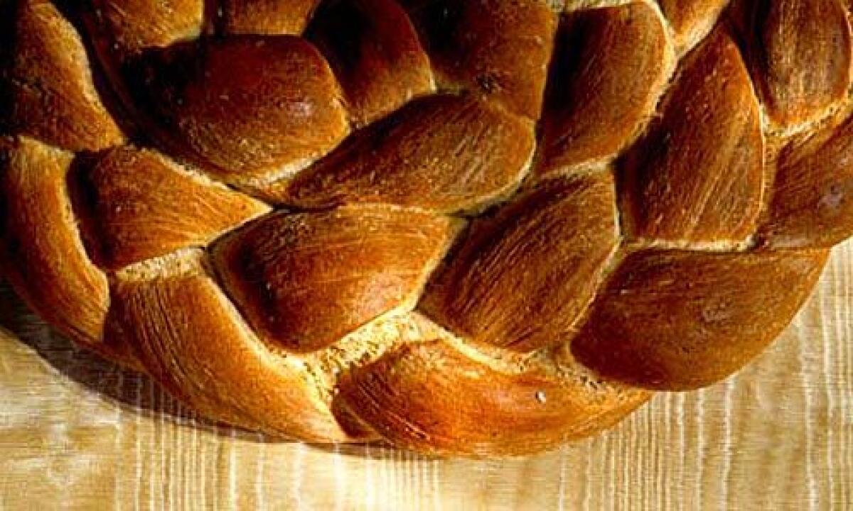 TOASTY PALETTE: The wheat-brown wreath of braided breads -- one seasoned with rosemary, the other spiked with pepper -- surprises and delights.