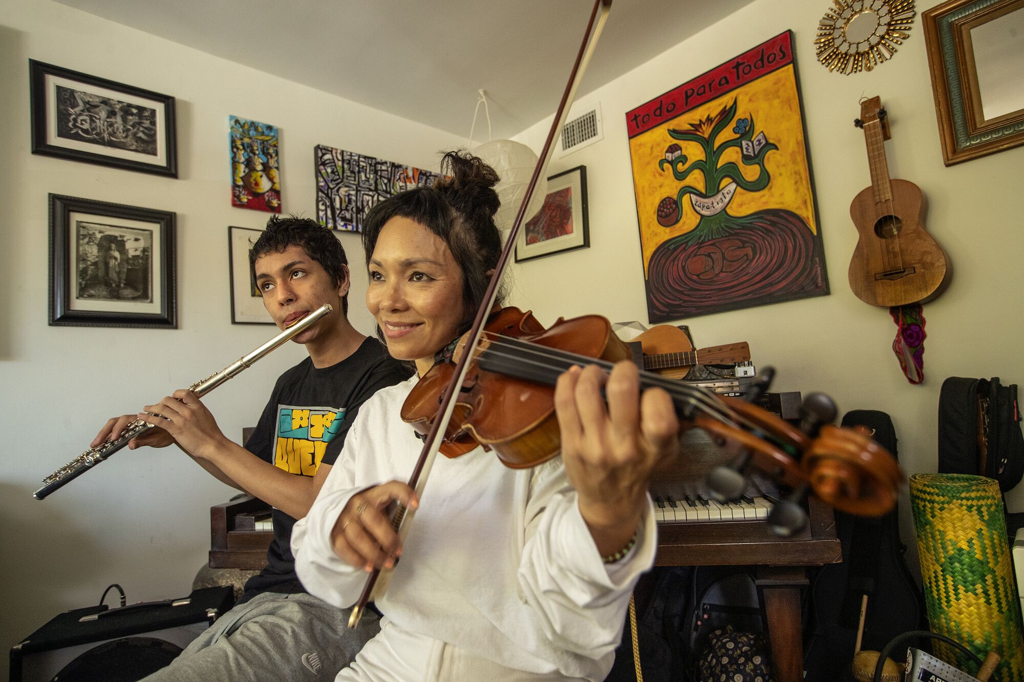 :Sandino Gonzalez-Flores and Tylana Enomoto, members of the band Quetzal, rehearse in Los Angeles.