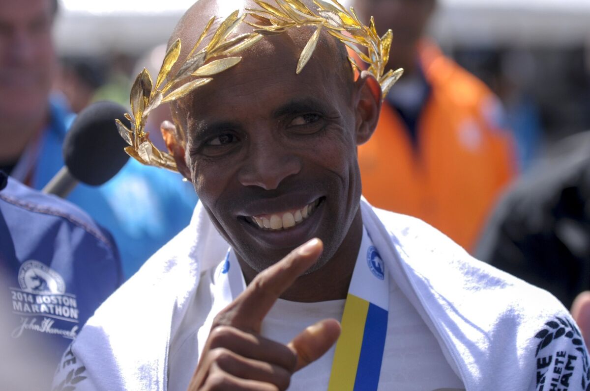 Meb Keflezighi celebrates winning the Boston Marathon on Monday, becoming the first American male to win since 1983.