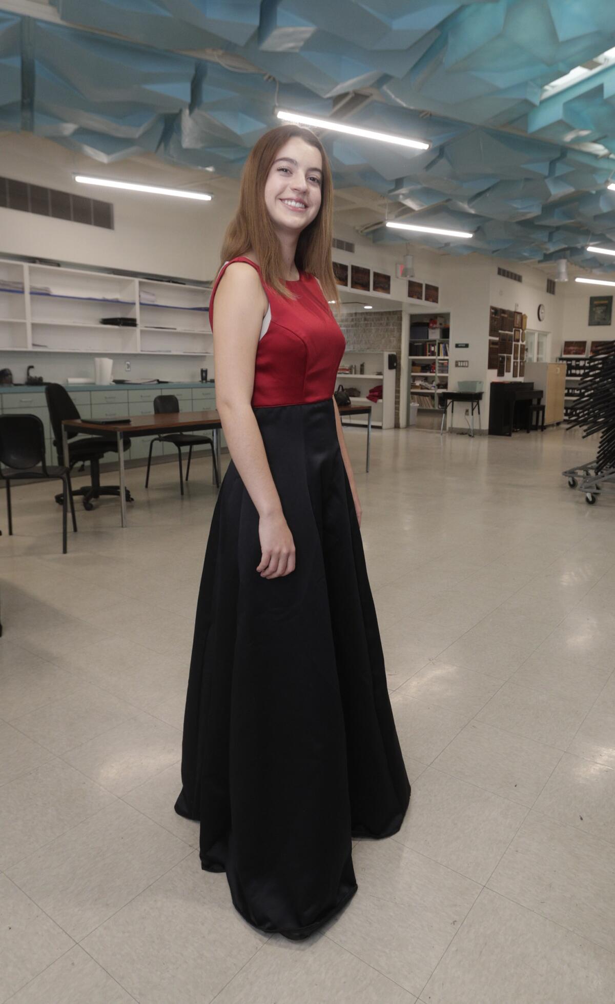 Maya Morgan, 18, who has been in the choir for six years, models a new gown for the La Cañada High School Choral program at LCHS on Friday, February 7, 2020.