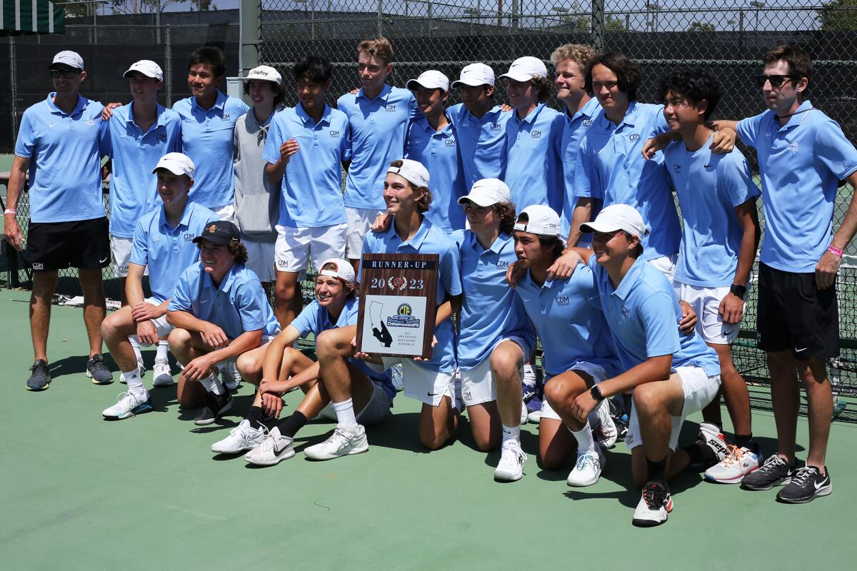 The Corona del Mar High School boys' tennis team poses for a picture with the CIF runner-up plaque after Friday's match.