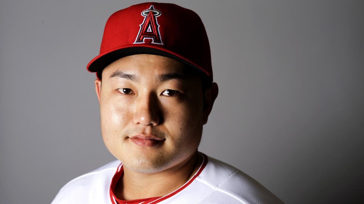 Ji-Man Choi poses for his portrait during media day at spring training.