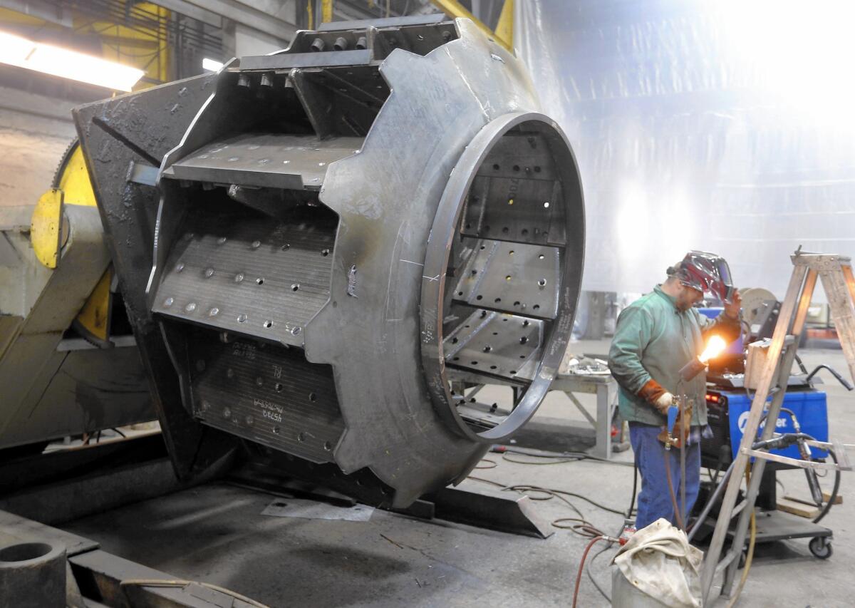 A worker welds parts at Robinson Fans Inc. in Harmony, Pa., in February. Wage growth should accelerate as the labor market improves, giving workers more money to spend, an analyst said.