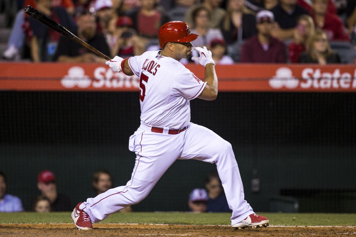 Angels first baseman Albert Pujols watches his hit during a game at Angel Stadium on June 3, 2015.