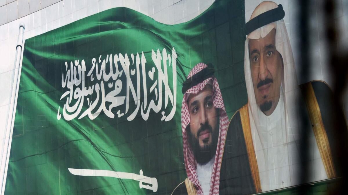 Portraits depict Saudi Crown Prince Mohammed bin Salman, left, and his father, King Salman, in Riyadh, Saudi Arabia.