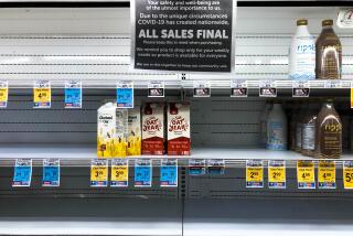 A scene from early in the pandemic, when shelves selling milk and milk alternatives were nearly empty at a supermarket.