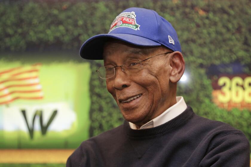 Ernie Banks talks during an interview at Wrigley Field in March 2014.