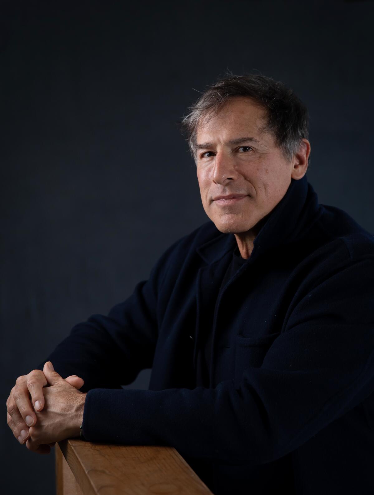 Writer-director David O. Russell looks at the camera for a portrait.