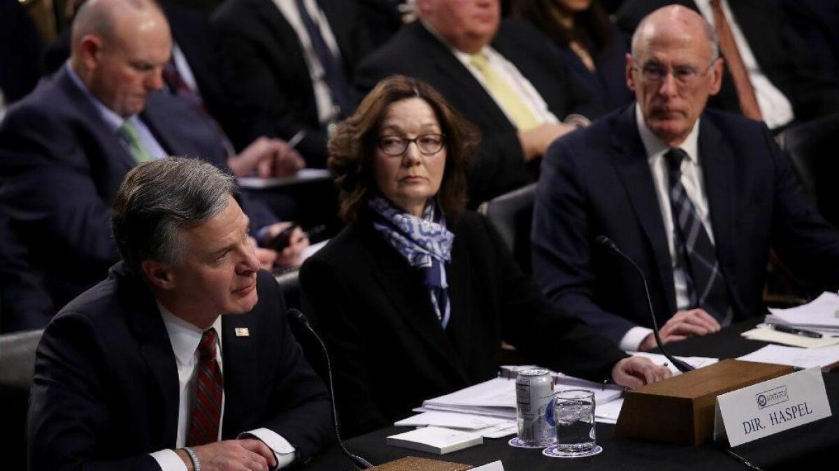 FBI Director Christopher Wray speaks during Jan. 29 testimony to the Senate Intelligence Committee as CIA Director Gina Haspel and Director of National Intelligence Dan Coates listen.