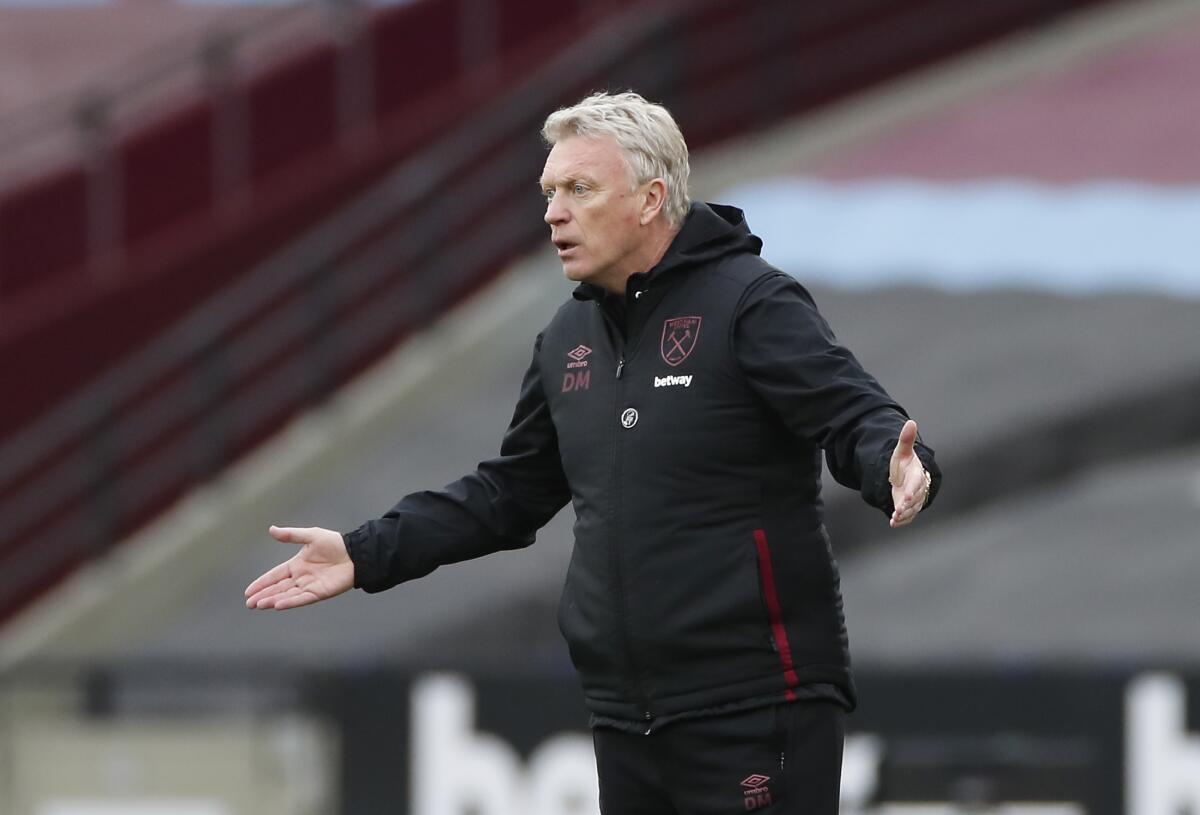 West Ham's manager David Moyes gives instructions during the English Premier League soccer match between West Ham United and Arsenal at the London Stadium in London, England, Sunday, March 21, 2021. (Paul Childs, Pool via AP)