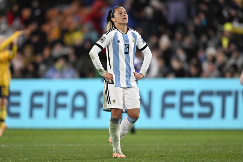 FILE - Argentina's Eliana Stabile walks on the pitch following a Women's World Cup Group G soccer match in Hamilton, New Zealand, Aug. 2, 2023. Stabile is one of four players who announced her exit from the team on Monday, May 27, 2024, due to a dispute with the Argentinian federation over pay and conditions. (AP Photo/Andrew Cornaga, File)