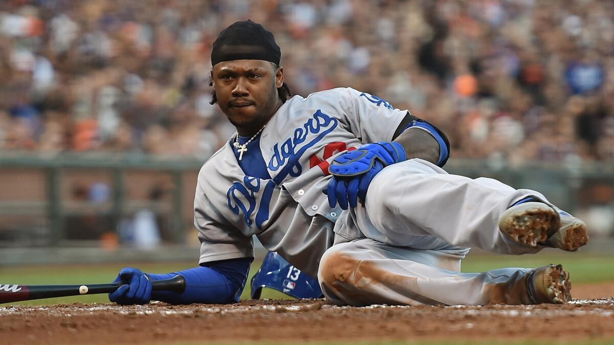 The Dodgers placed shortstop Hanley Ramirez on the disabled list Sunday because of a right oblique muscle strain. Above, Ramirez falls to the ground after nearly being hit by a pitch in a game July 26 against the San Francisco Giants.