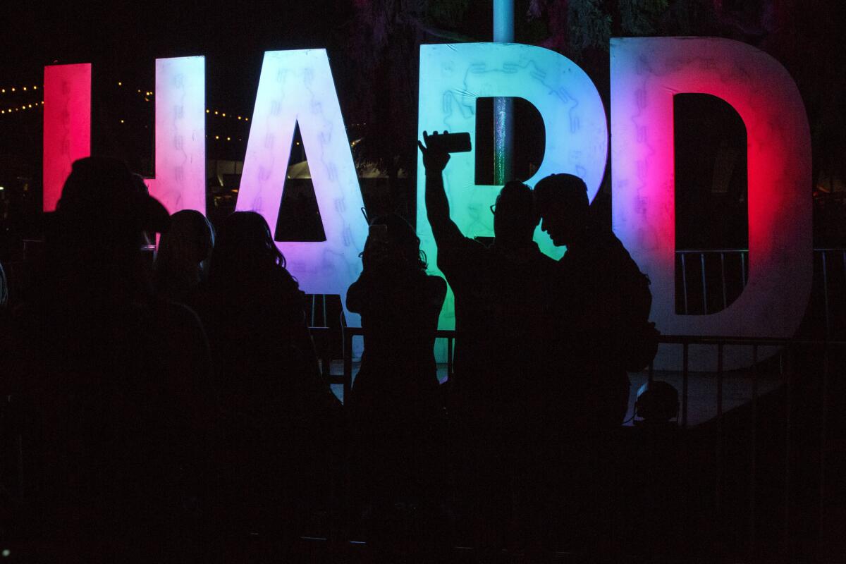 Music fans attend the HARD Day of the Dead Halloween-themed rave at the Pomona Fairplex on Saturday.