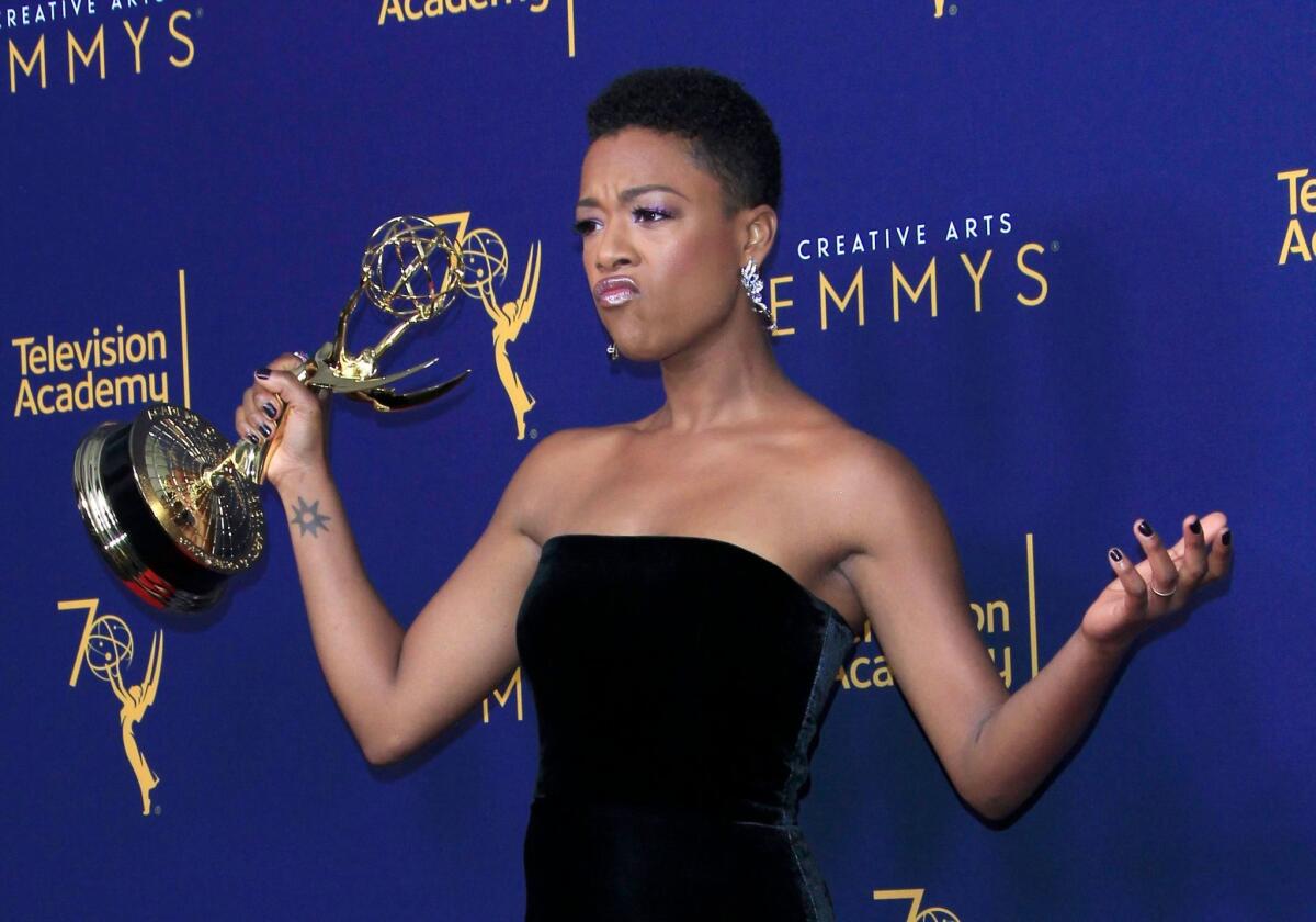 Samira Wiley holds the Emmy for guest actress in a drama series at the 2018 Creative Arts Emmy Awards.