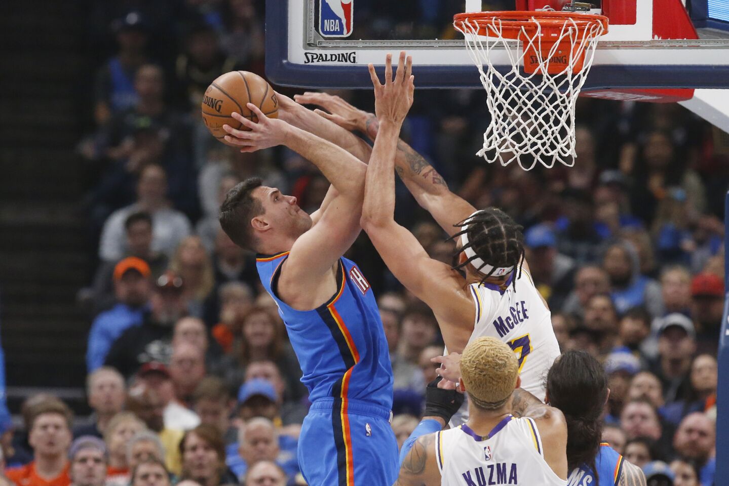 Thunder forward Danilo Gallinari is fouled by Lakers center JaVale McGee (7) during a game Jan. 11 at Chesapeake Energy Arena.