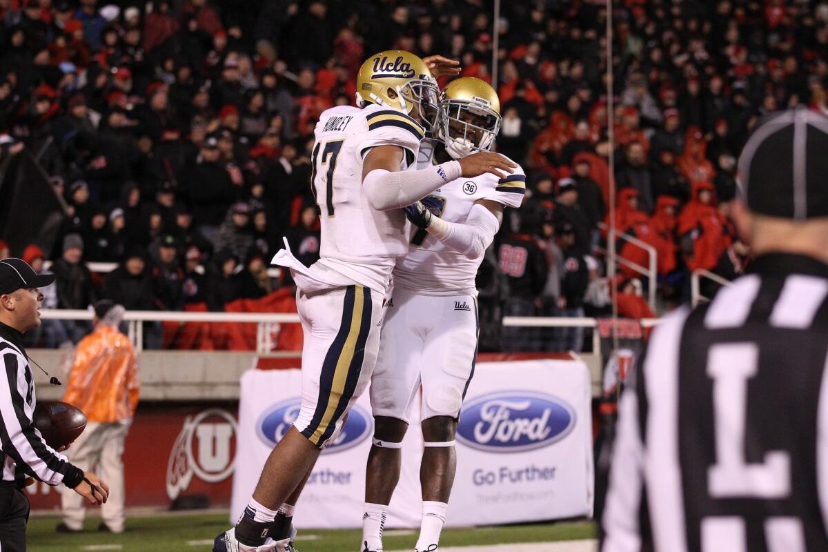 UCLA quarterback Brett Hundley, left, and receiver Devin Fuller celebrate a touchdown in a win over California last week. The Bruins hope to stay undefeated on the season against Stanford on Saturday.