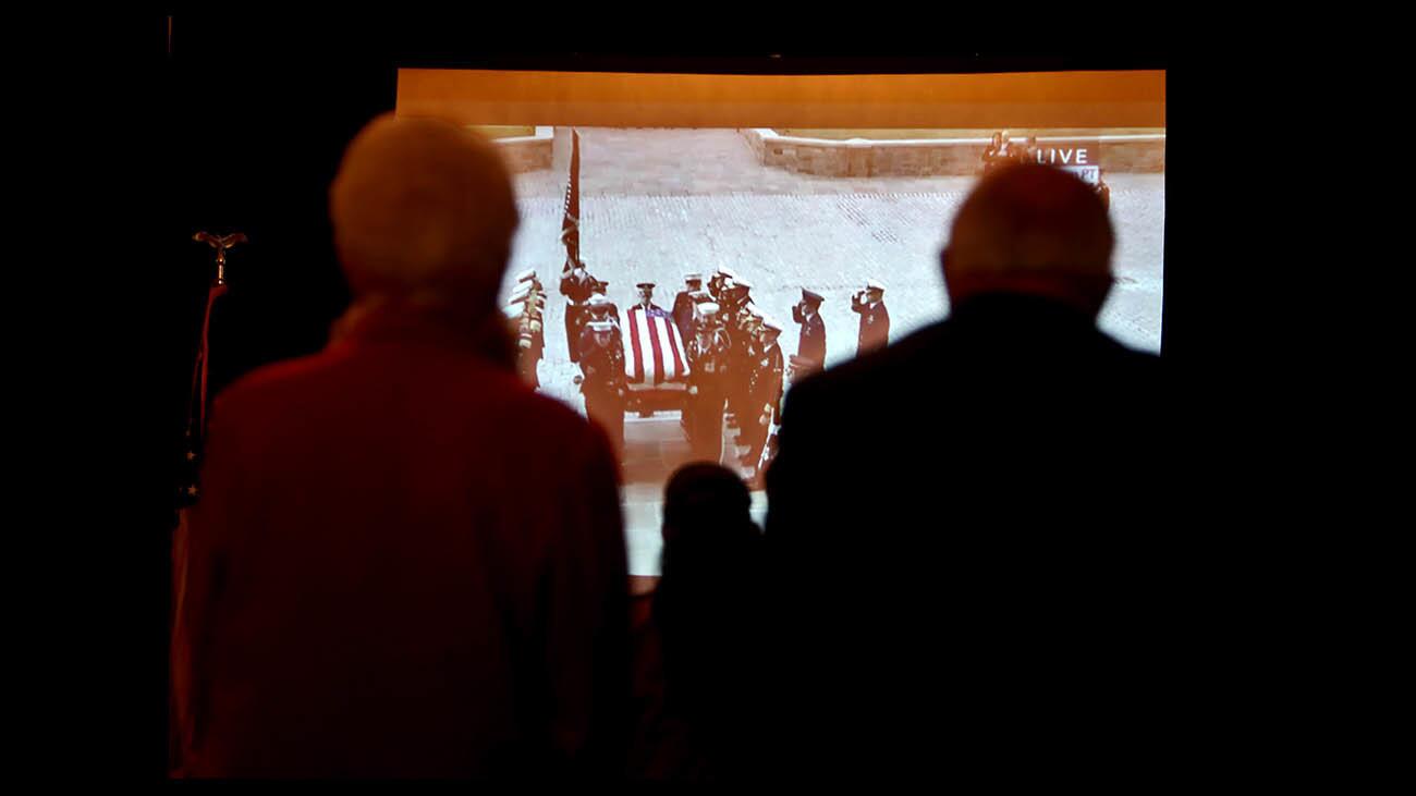 Photo Gallery: Visitors watch broadcast of State Funeral for President George H.W. Bush at Nixon Library