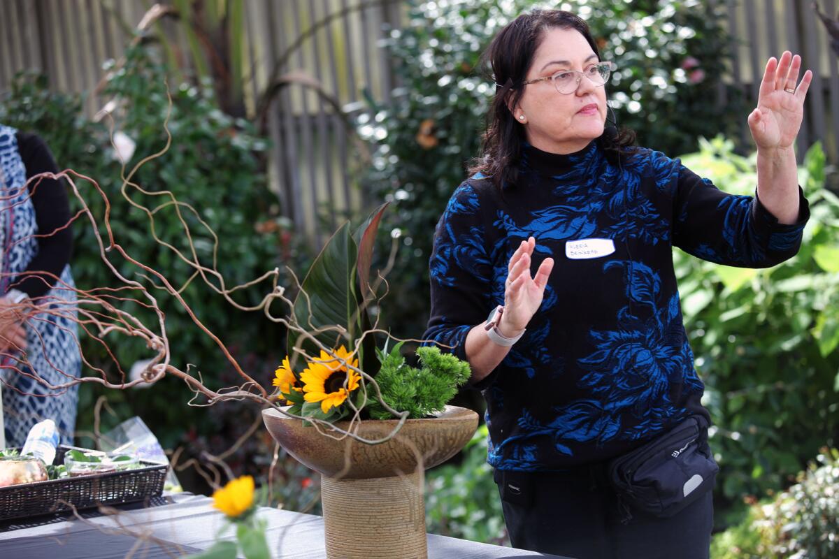 Valeria Brinkers, a master Ikebana instructor, speaks.