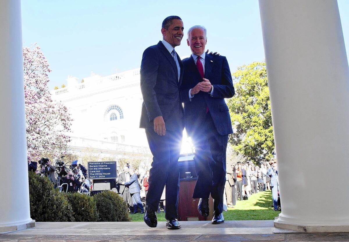 President Obama walks back to the Oval Office with Vice President Joe Biden after delivering a statement on the Affordable Care Act at the White House Rose Garden. “This law is doing what it’s supposed to do,” Obama said, “all of which makes the lengths to which critics have gone to scare people or undermine the law or try to repeal the law without offering any plausible alternative so hard to understand.”