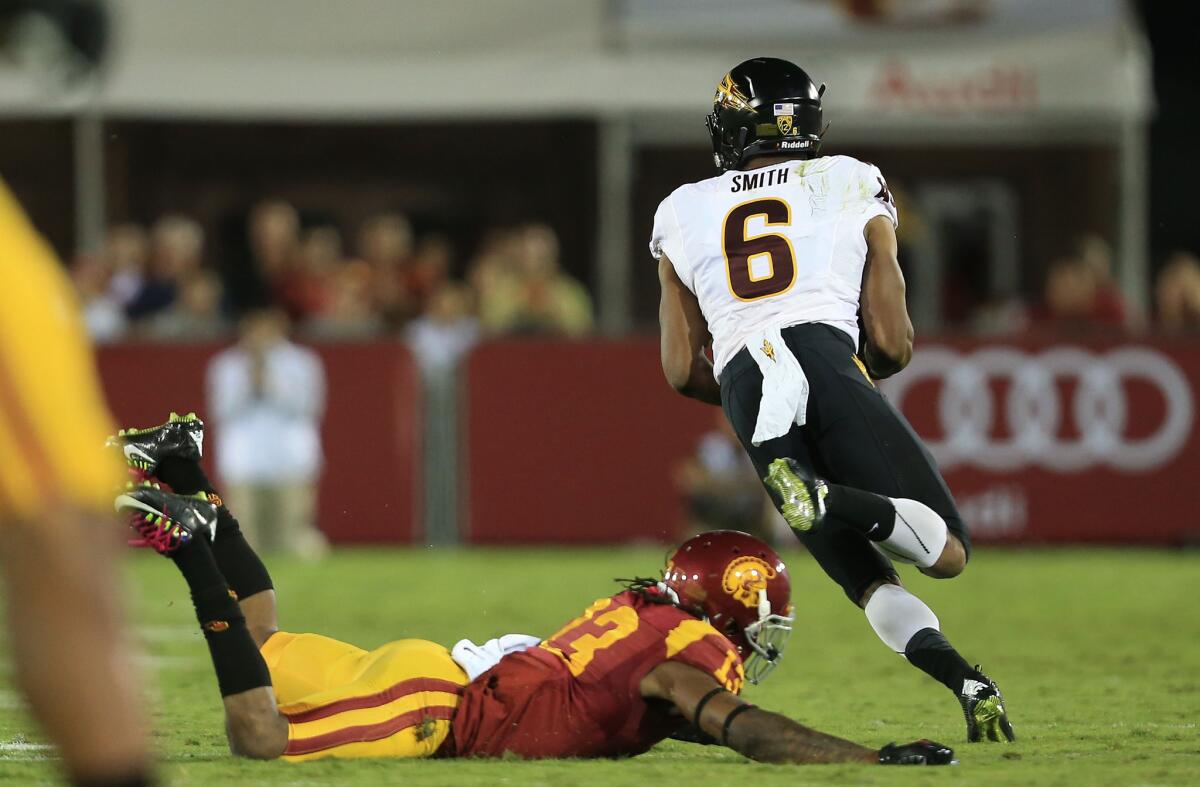 Arizona State's Cameron Smith avoids a tackle by USC's Kevon Seymour and runs for a 73-yard touchdown reception in the fourth quarter of the Sun Devils' 38-34 victory on Oct. 4.