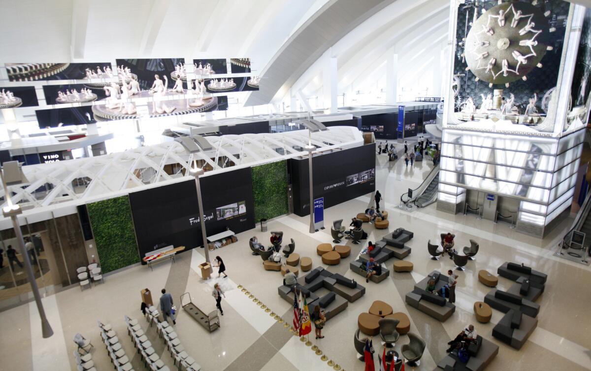 A new survey says passenger spending on food, drink and retail items is up at U.S. airports. Here, multimedia displays entertain passengers at the recently ugpraded and expanded Bradley International Terminal at LAX.
