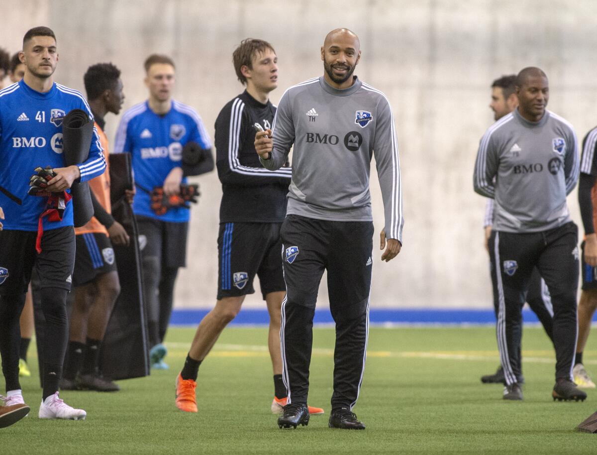 Montreal Impact MLS soccer team head coach Thierry Henry, center, conducts his first practice in Montreal, Tuesday, Jan. 14, 2020. (Ryan Remiorz/The Canadian Press via AP)