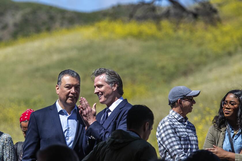 AGOURA HILLS, CA-APRIL 22, 2022: U.S. Senator Alex Padilla, left, and Governor Gavin Newsom attend the Wallis Annenberg Wildlife Crossing Groundbreaking Ceremony, held near the location of the future wildlife crossing in Agoura Hills. Spanning over ten lanes of the 101 freeway, when complete, the crossing will be the largest in the world, the first of its kind in California and a global model for urban wildlife conservation. (Mel Melcon / Los Angeles Times)