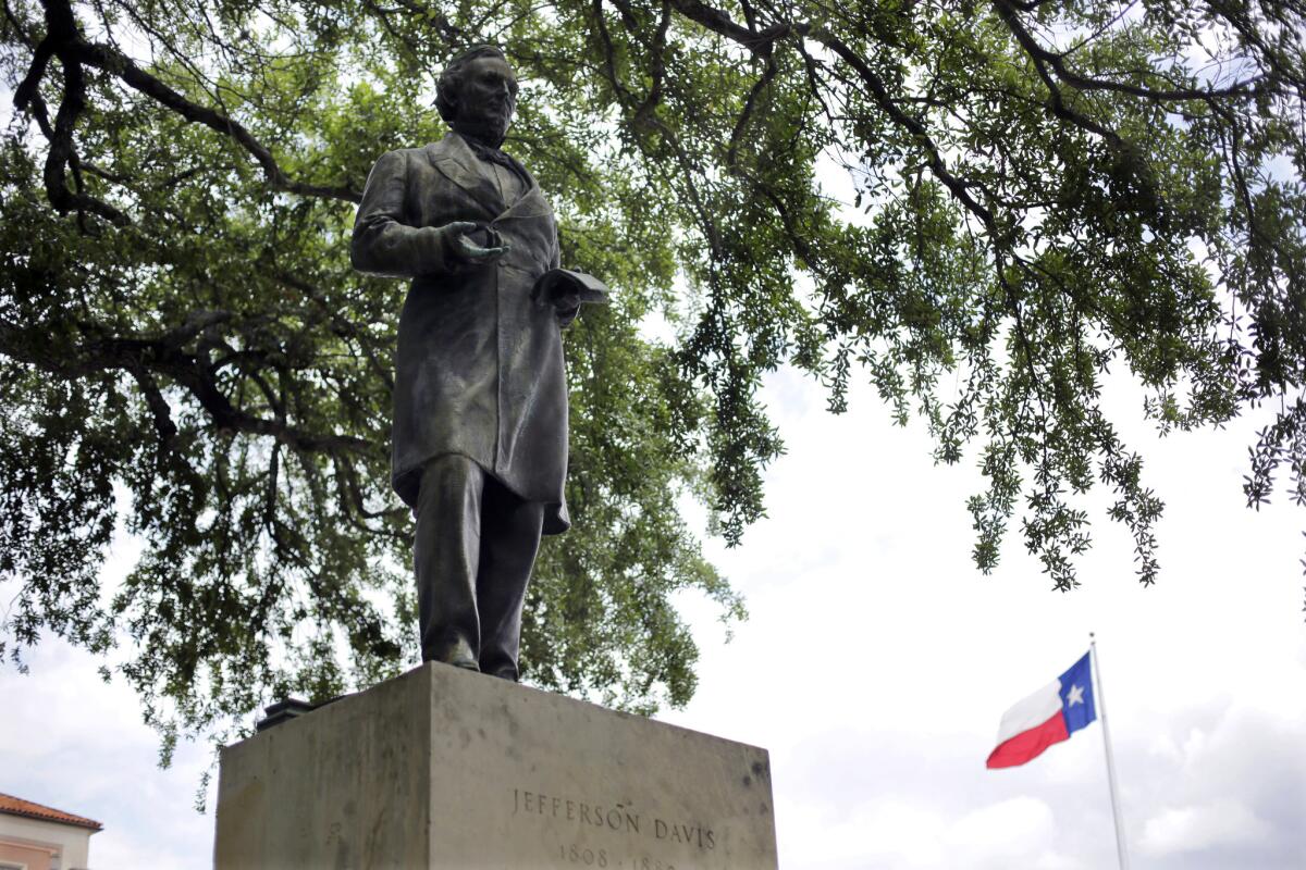 This statue of Jefferson Davis, which has stood at the center of the University of Texas campus for years, is being moved to a lower-profile spot. Staues of other Confederate leaders, however, will stay.
