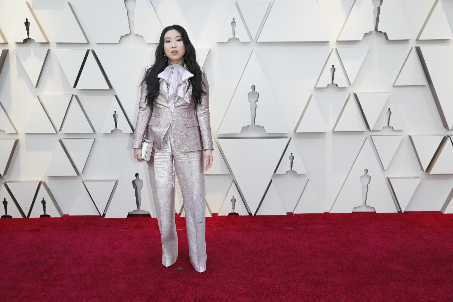 HIT: Awkwafina brings her best “Austin Powers” look with a giant bow shirt under a glittering pink suit by DSquared2. (The actress-singer said the Canadian brothers “have been dressing me since the beginning.”)
