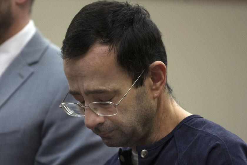 Mandatory Credit: Photo by RENA LAVERTY/EPA-EFE/REX/Shutterstock (9333527l) Larry Nassar Sentencing of Dr. Larry Nassar, Lansing, USA - 24 Jan 2018 Larry Nassar looks down during court proceedings in the sentencing phase for Dr. Larry Nassar who is facing prison on multiple counts of sexual abuse of minors, in Lansing, Michigan, USA, 24 January 2018. Nassar was a doctor at Michigan State University and for the US Gymnastics team and has been convicted in Federal Court and faces additional sentencing in Michigan. Larry Nassar is sentenced to 40 to 175 years in prison. ** Usable by LA, CT and MoD ONLY **