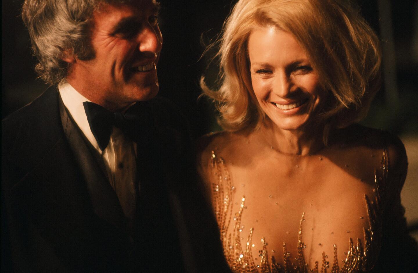 Burt Bacharach in a tuxedo and Angie Dickinson in an elegant evening gown